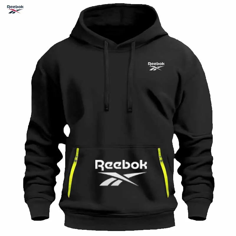 "Sudadera deportiva Reebok para hombre: sudadera con capucha tipo pullover, holgada y casual, de color liso con diseño de múltiples bolsillos, simple y limpia."