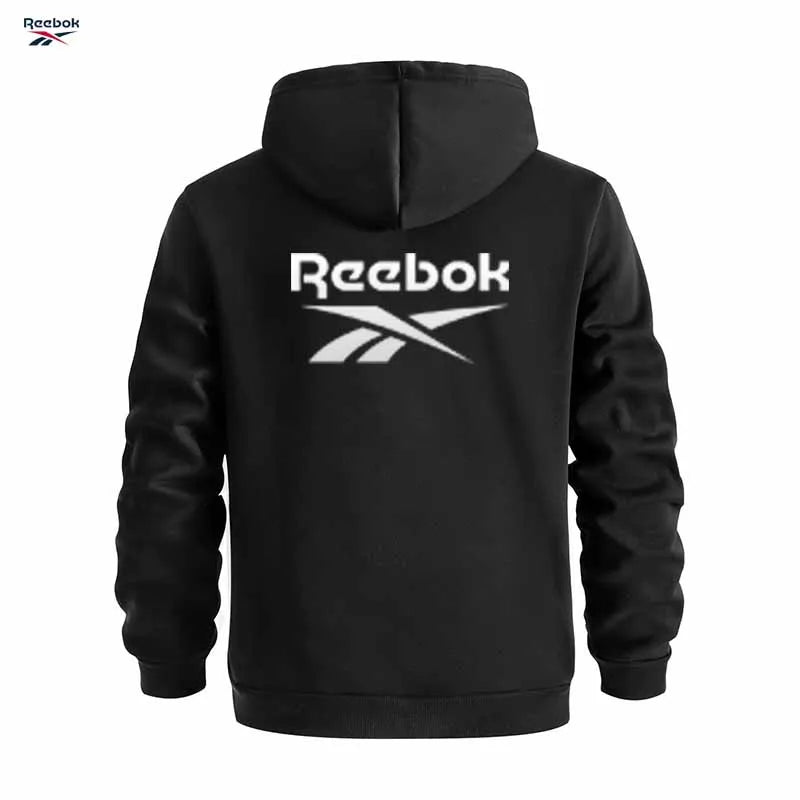 "Sudadera deportiva Reebok para hombre: sudadera con capucha tipo pullover, holgada y casual, de color liso con diseño de múltiples bolsillos, simple y limpia."