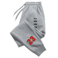 "Nuevos pantalones deportivos casuales para hombre y mujer (otoño/invierno), estilo urbano con letras estampadas y diseño atlético para adultos."